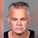 This Clark County Detention Center photo provided by the Las Vegas Metropolitan Police shows Eric Holland, 57, following his arrest Thursday, Dec. 23, 2021, in Las Vegas.