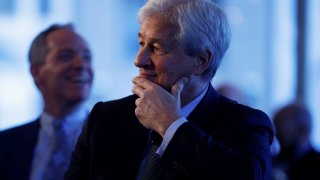 JP Morgan CEO Jamie Dimon listens as he is introduced at the Boston College Chief Executives Club luncheon in Boston, Massachusetts, U.S., November 23, 2021.