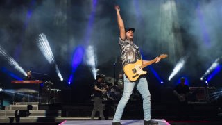 Luke Bryan is seen performing onstage