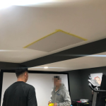 A photo provided by Jeff Hawley shows a hole in the ceiling being patched up after he said a construction worker fell through into the basement.