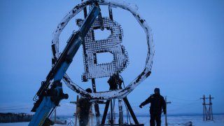 A bitcoin sculpture made from scrap metal is installed outside the BitCluster cryptocurrency mining farm in Norilsk, Russia, on Sunday, Dec. 20, 2020.