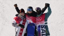 From left, silver medalist United States's Julia Marino, gold medalist New Zealand's Zoi Sadowski Synnott and bronze medalist Australia's Tess Coady celebrate after the women's slopestyle finals at the 2022 Winter Olympics, Feb. 6, 2022, in Zhangjiakou, China.