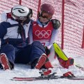 A team member consoles Mikaela Shiffrin, of the United States after she skied out in the first run of the Women's Slalom at the 2022 Winter Olympics, Feb. 9, 2022, in the Yanqing district of Beijing, China.