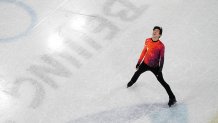 Nathan Chen smiles after completing his routine