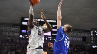 Connecticut's Adama Sanogo shoots over Xavier's Jack Nunge (24) in the first half of an NCAA college basketball game, Saturday, Feb. 19, 2022, in Storrs, Conn.
