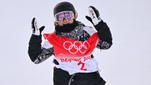 USA's Chloe Kim reacts after her run