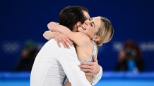 Team USA's Ashley Cain-Gribble and USA's Timothy Leduc celebrate after competing in the pair skating short program at the 2022 Winter Olympic Games, Feb. 18, 2022, in Beijing.
