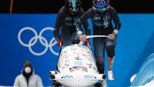 Kaillie Humphries and Kaysha Love of Team USA compete in a 2-woman bobsleigh heat at the 2022 Winter Olympic Games, Feb. 19, 2022.