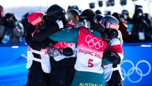 Competitors for the women's snowboard slopestyle gather for a celebratory group hug at Genting Snow Park on Feb. 6, 2022, in Zhangjiakou, China. New Zealand won their first ever gold at the event, with the US breaking their medal-less streak with Julia Marino's silver.