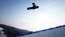 Chloe Kim of United States performs a trick during the Women's Snowboard Cross Qualification on Day 5 of the 2022 Winter Olympics at Genting Snow Park on Feb. 9, 2022, in Zhangjiakou, China.