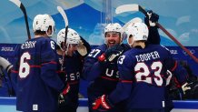 Noah Cates #27 of Team United States celebrates a goal with teammates in the second period of the game against Team China during the Men's Ice Hockey preliminary round at the 2022 Winter Games in the National Indoor Stadium, Feb. 10, 2022, in Beijing, China.