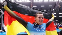 Christopher Grotheer of Team Germany wins gold in Men's Skeleton at the 2022 Winter Olympic Games, Feb. 11, 2022, in Yanqing, China.