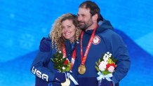 Gold medallists Lindsey Jacobellis and Nick Baumgartner of Team United States pose with their medals during the Mixed Team Snowboard Cross medal ceremony at the 2022 Winter Olympic Games, Feb. 12, 2022, in Zhangjiakou, China.