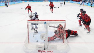 Hilary Knight of Team United States puts her own rebound into the net