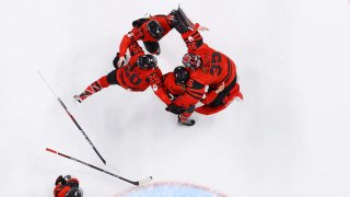 eam Canada celebrate after defeating Team United States 3-2 in the Women's Ice Hockey Gold Medal