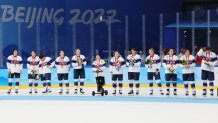 Team United States stands with their silver medals after the Women's Ice Hockey Gold Medal match between Team Canada and Team United States at the 2022 Winter Olympic Games, Feb. 17, 2022, in Beijing.