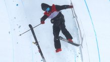 Gus Kenworthy of Team Great Britain crashes on his second run during the Men's Freestyle Skiing Halfpipe Final at the 2022 Winter Olympics, Feb. 19, 2022, in Zhangjiakou, China.