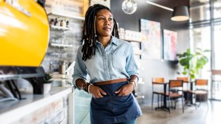 Portrait of female coffeeshop owner in coffeeshop
