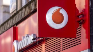 A sign outside a Vodafone Group Plc mobile phone store in London, U.K., on Monday, Jan. 17, 2022.