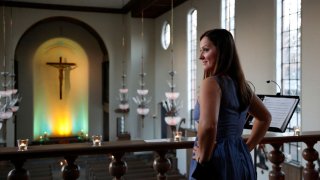 Karolina Wojteczko, a mezzo-soprano who serves as music director at Yale University’s St. Thomas More Catholic chapel, prepares to perform at a benefit concert for Ukraine in New Haven, Conn., Wednesday, March 16, 2022. Wojteczko, a native of Poland, was inspired to organize the concert by the distress she has noticed among both Eastern European and American friends.