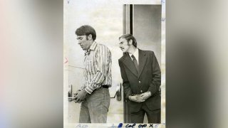 Manacled suspects in the Chowchilla school bus kidnap case, James Schoenfeld and Frederick Woods, from left, leave the Madera County Government Center on their way back to the Alameda County Jail.