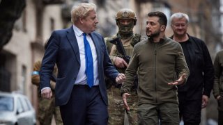 Ukraine’s President Volodymyr Zelenskyy and British Prime Minister Boris Johnson walk at the Independence Square after a meeting, as Russia’s attack on Ukraine continues, in Kyiv, Ukraine April 9, 2022.