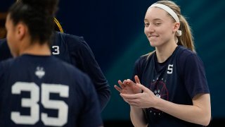 UConn's Paige Bueckers claps during a practice session for a college basketball game