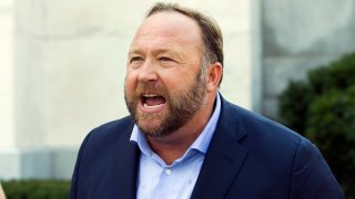 Infowars host and conspiracy theorist Alex Jones speaks outside of the Dirksen building on Capitol Hill