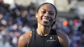 Allyson Felix, of the United States, smiles after finishing third in the women's 400 meters during the Meeting de Paris Diamond League athletics meet at Stade Charlety in Paris, Saturday, Aug. 28, 2021.