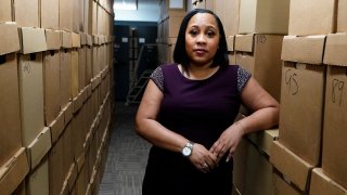 FILE - Fulton County District Attorney Fani Willis poses for a photo at her office, Feb. 24, 2021 in Atlanta. When potential grand jurors show up at an Atlanta courthouse Monday, May 2, 2022 they'll find a television camera in the room and streets closed outside — nods to the intense public interest in the investigation into whether former President Donald Trump and others illegally tried to pressure Georgia officials to overturn Joe Biden’s presidential election victory in the state.