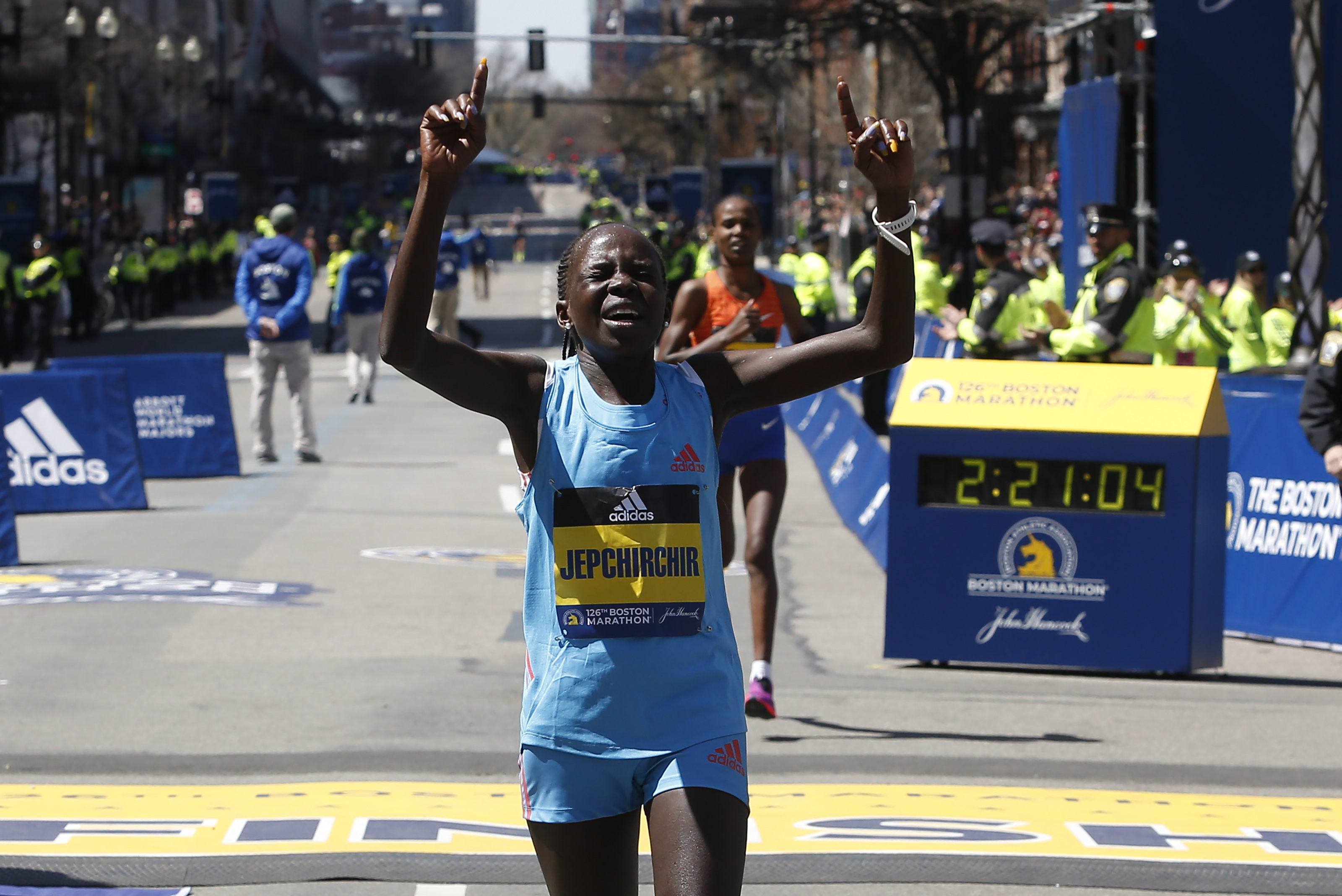 Boston, MA – April 18: Peres Jepchirchir of Kenya celebrates after crossing the finish line to win the 126th Boston Marathon in Boston on April 18, 2022. (Photo by Jessica Rinaldi/The Boston Globe via Getty Images)