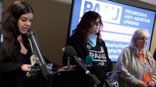 Anti-abortion activists Lauren Handy and Joan Andrews Bell listen as Terrisa Bukovinac speaks during a news conference on the five fetuses found inside the home where anti-abortion activists were living on Capitol Hill. The activists, who are members of the Progressive Anti-Abortion Uprising group, held the news conference to answer questions on how the group came to attain the remains of the aborted fetuses.