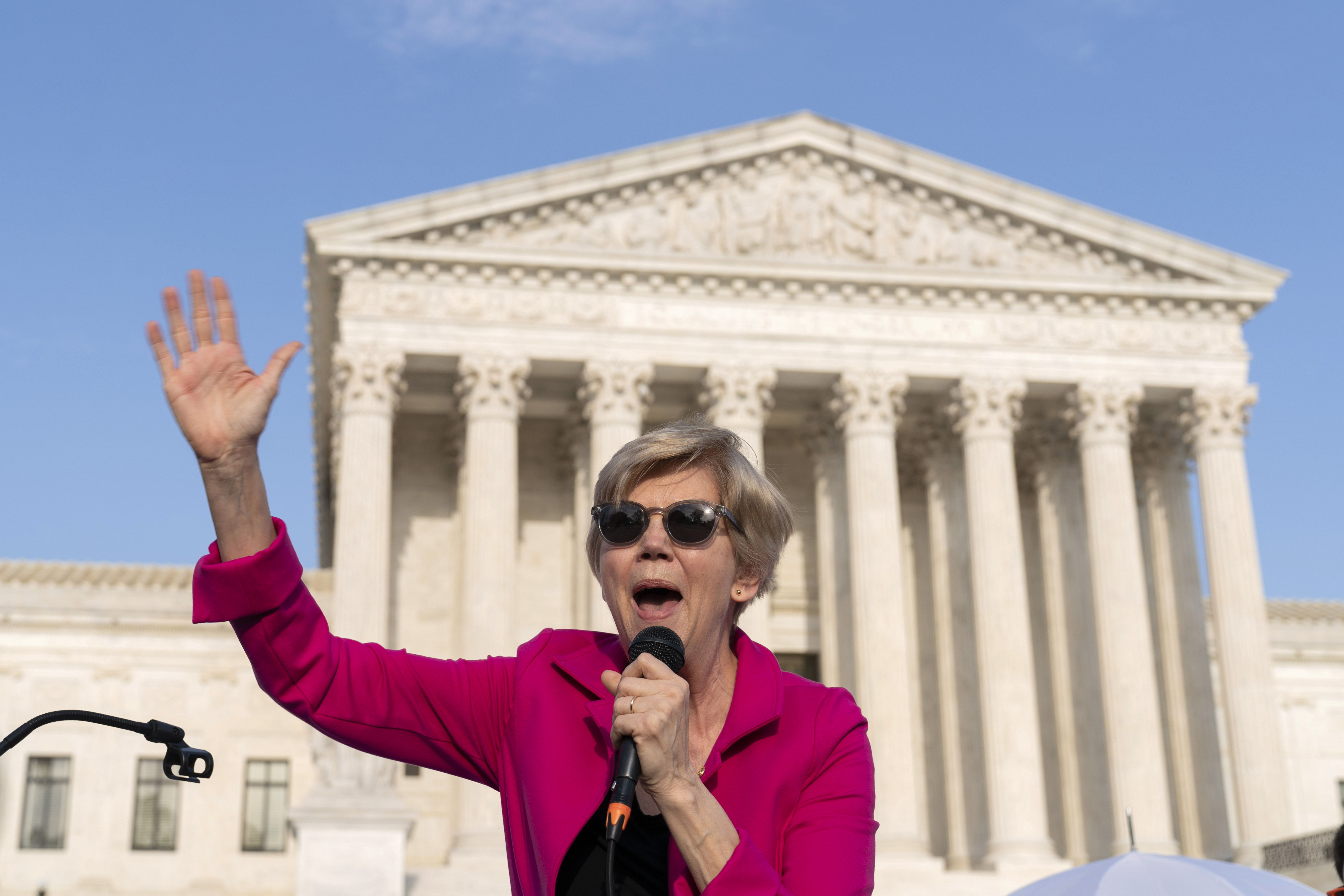 Sen. Elizabeth Warren, D-Mass., speaks outside of the U.S. Supreme Court Tuesday, May 3, 2022 in Washington.