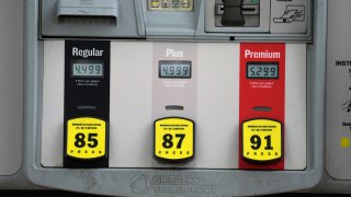 The prices are dispalyed above the various grades of gasoline available at a Conoco station Saturday, May 21, 2022, in Denver.
