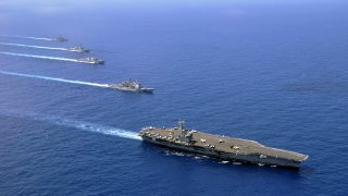 The Quad’s MDA program may further militarize the Indo-Pacific region, where U.S. aircraft carrier USS Nimitz is seen here in a file photo leading a formation.