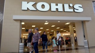 People walk near a Kohl’s department store entranceway on June 07, 2022 in Doral, Florida. Kohl’s announced that it has entered into exclusive negotiations with Franchise Group, which is proposing to buy the retailer for $60 per share.