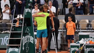 Alexander Zverev of Germany and Rafael Nadal of Spain embrace each other as Alexander Zverev of Germany is being forced to retire following an injury against Rafael Nadal of Spain during the Men's Singles Semi Final match on Day 13 of The 2022 French Open at Roland Garros on June 3, 2022, in Paris, France.