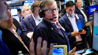 Traders work on the floor of the New York Stock Exchange (NYSE), July 21, 2022.