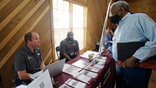 Robert Allen, director of work based learning, left, and Rod Mallett, work based learning coordinator, center, at Hinds Community College
