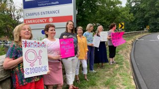 Residents from various communities in mostly rural northeastern Connecticut stage a protest outside Day Kimball Hospital