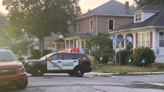 Police and fire officials after fatal fire in New London
