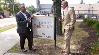 Fred Hodges, left, and Da'ee McKnight talk outside where they work at Family ReEntry a reentry support group