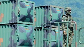 A Taiwanese soldier stands by a Sky Bow III (Tien-Kung III) Surface-to-Air missile system at a base in Taiwan's southeastern Hualien county