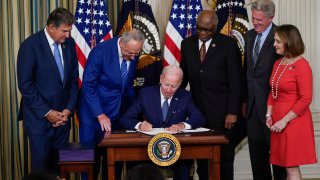 FILE - President Joe Biden signs the Democrats' landmark climate change and health care bill