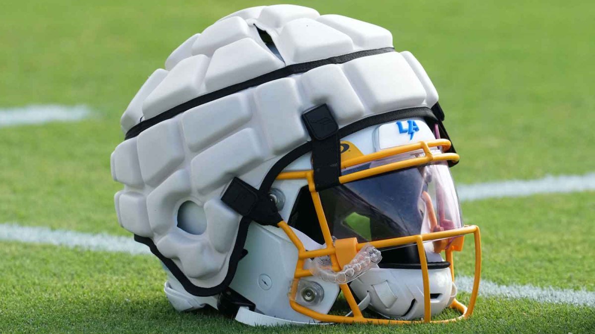 Why are NFL players wearing padding on helmets at training camp?