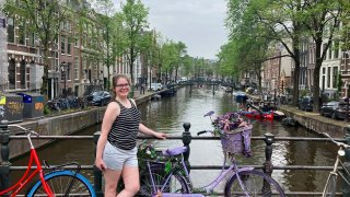 Darcy, founder of the financial blog We Want Guac, visited seven countries this summer — and spent just $2,782.20 on the entire trip. Here she is pictured in Amsterdam.