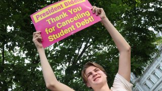 Student loan borrowers stage an Aug 25, 2022 rally in front of the White House to celebrate President Joe Biden canceling some federal student debt.