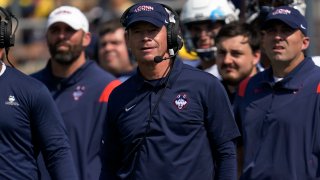 Connecticut head coach Jim Mora watches the first half of an NCAA college football game against Michigan in Ann Arbor, Michigan, Sept. 17, 2022.