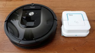 FILE – In this Thursday, Aug. 25, 2016, photo, an iRobot Roomba vacuum, left, and Braava Jet floor cleaner are displayed at the company’s headquarters in Bedford, Mass.
