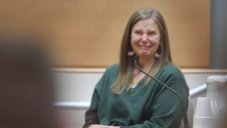 Alissa Parker, mother of deceased Sandy Hook Elementary School student Emilie Parker, breaks down in tears as she testifies in the Alex Jones defamation trial at Superior Court in Waterbury, Conn., on Wednesday, Sept. 28, 2022.